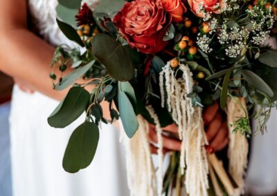 Bride holding flowers in hand: Bridal Bouquet